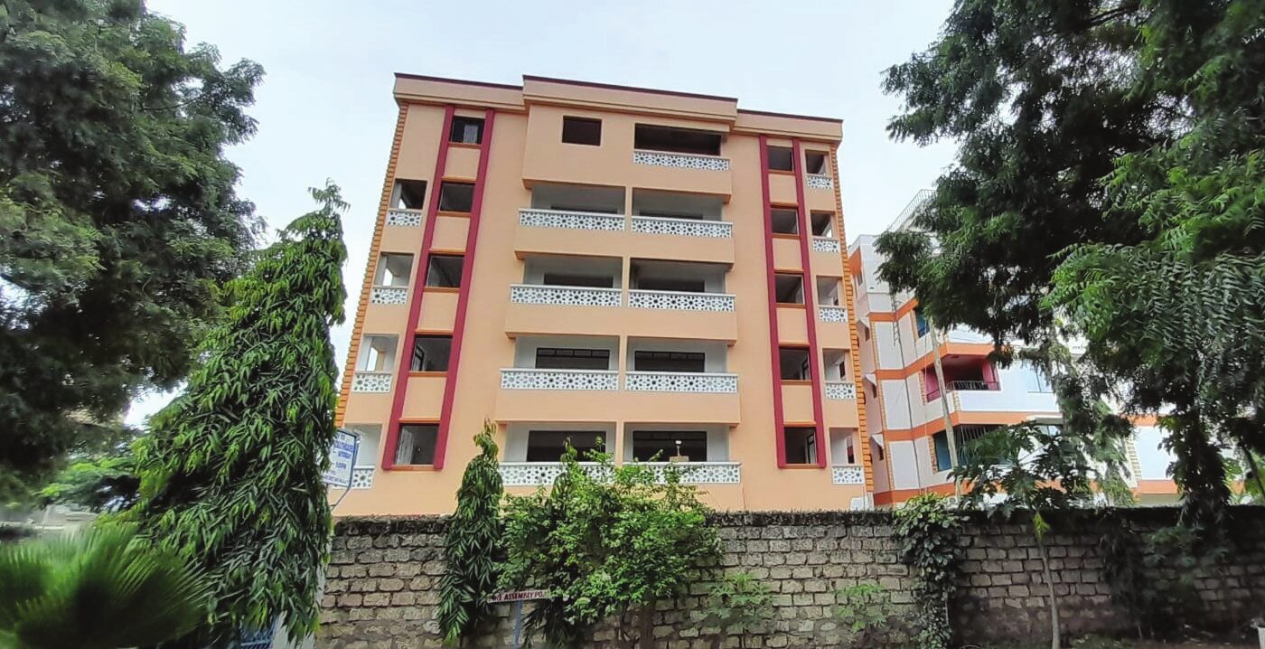 Peach and red six-storey apartment block in Mtwapa