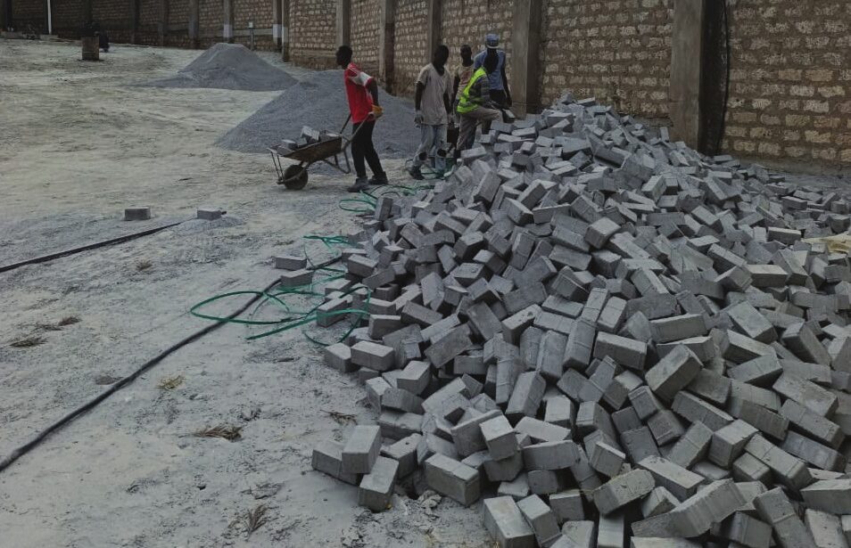 Crew laying cabro paving blocks